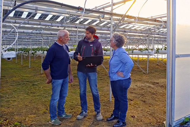 Farmers under solar installation